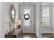 Inviting entryway with stylish console table and statement mirror at 2915 Winter Crop Way, Apex, NC 27502