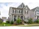 Charming two-story home with a covered front porch and well-manicured landscaping at 2915 Winter Crop Way, Apex, NC 27502