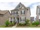 Lovely two-story home with a welcoming front porch, complemented by neat landscaping at 2915 Winter Crop Way, Apex, NC 27502