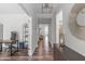 Inviting hallway with hardwood floors and stylish decor connects various living spaces in the home at 2915 Winter Crop Way, Apex, NC 27502