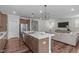 Modern kitchen island with double sink and view of living room at 2915 Winter Crop Way, Apex, NC 27502