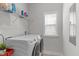 Functional laundry room with a washer, dryer, and ample shelving at 2915 Winter Crop Way, Apex, NC 27502