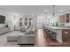 Open-concept living room flowing into a modern kitchen, ideal for entertaining and Gathering gatherings at 2915 Winter Crop Way, Apex, NC 27502
