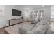 Spacious living room with a plush sectional sofa, large TV, and stylish decor for comfortable living at 2915 Winter Crop Way, Apex, NC 27502