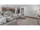 Comfortable living room featuring a large sectional sofa and a stylish rug at 2915 Winter Crop Way, Apex, NC 27502