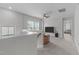 Upstairs living room features a ceiling fan, windows, and neutral decor at 2915 Winter Crop Way, Apex, NC 27502