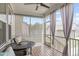 Cozy screened porch featuring a round table, chairs, and curtains at 2915 Winter Crop Way, Apex, NC 27502