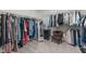 Spacious walk-in closet with ample storage, mirror and seating at 2915 Winter Crop Way, Apex, NC 27502