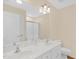 Bathroom featuring a double sink vanity, a large mirror, and a walk-in shower at 3027 Maple Ave # A-1, Burlington, NC 27215