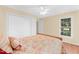 Bedroom featuring hardwood floors, a ceiling fan and a window for lots of natural light at 3027 Maple Ave # A-1, Burlington, NC 27215
