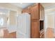 Kitchen featuring dark countertops, wooden cabinets, stainless steel appliances, and white refrigerator at 3027 Maple Ave # A-1, Burlington, NC 27215