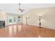 Bright living room featuring hardwood floors, fireplace, ceiling fan, and a sliding glass door at 3027 Maple Ave # A-1, Burlington, NC 27215