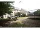 Backyard showcasing outdoor seating, trampoline, and a covered patio area at 309 Forest Haven Drive Dr, Holly Springs, NC 27540