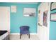 Bedroom featuring teal walls, a decorative mirror, and white doors, creating a stylish and tranquil space at 309 Forest Haven Drive Dr, Holly Springs, NC 27540