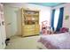 Bright bedroom with a purple coverlet, built-in bookshelf and toys creating a fun and imaginative retreat at 309 Forest Haven Drive Dr, Holly Springs, NC 27540