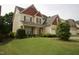 Charming two-story home with a well-manicured lawn and beautiful landscaping at 309 Forest Haven Drive Dr, Holly Springs, NC 27540