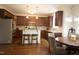 Well-equipped kitchen featuring stainless steel appliances, dark cabinetry, and a breakfast bar at 309 Forest Haven Drive Dr, Holly Springs, NC 27540