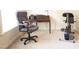 Functional office space with desk, chair, and exercise equipment near a window at 309 Forest Haven Drive Dr, Holly Springs, NC 27540