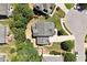 Overhead aerial showcasing the house roof, lawn, and a neighboring street at 309 Larkhaven Pl, Apex, NC 27539