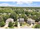 Scenic aerial view of a charming home in a lush, tree-filled neighborhood at 309 Larkhaven Pl, Apex, NC 27539