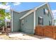 Rear exterior featuring a paved patio area, fence, and outdoor grill at 309 Larkhaven Pl, Apex, NC 27539