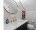 This powder room has a modern sink, gold fixtures, decorative mirror, and a stylish artistic touch at 309 Larkhaven Pl, Apex, NC 27539