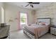 Charming bedroom with wood accent wall, neutral colors, and natural light from a window at 309 Larkhaven Pl, Apex, NC 27539