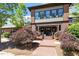 Inviting clubhouse entrance with brick pathway, manicured shrubs, and ample parking at 309 Larkhaven Pl, Apex, NC 27539