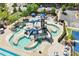 Community pool area features a waterpark with slides, swimming areas, and lounge seating at 309 Larkhaven Pl, Apex, NC 27539