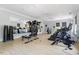 Bright gym offering top-of-the-line fitness equipment and mirrors for a complete workout experience at 309 Larkhaven Pl, Apex, NC 27539