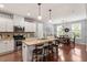 Stylish kitchen with a center island, pendant lighting, stainless steel appliances, and granite countertops at 309 Larkhaven Pl, Apex, NC 27539
