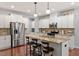 Beautiful kitchen featuring white cabinets, stainless steel appliances, and granite countertops at 309 Larkhaven Pl, Apex, NC 27539