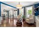Comfortable living room featuring hardwood floors, natural light, and neutral color palette for inviting appeal at 309 Larkhaven Pl, Apex, NC 27539