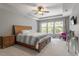 Bright main bedroom with trey ceilings, soft colors, and lots of natural light at 309 Larkhaven Pl, Apex, NC 27539