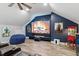 This media room features tiered seating, a large screen, ceiling fan and fun movie decor at 309 Larkhaven Pl, Apex, NC 27539