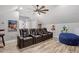 Media room featuring tiered seating, fun movie decor, and a ceiling fan at 309 Larkhaven Pl, Apex, NC 27539