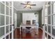 Comfortable home office featuring hardwood floors, a ceiling fan, and a built in Murphy bed at 309 Larkhaven Pl, Apex, NC 27539