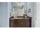 Bathroom vanity with a dark wood cabinet and granite countertop at 309 Plank Bridge Way, Morrisville, NC 27560