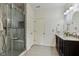 Modern bathroom featuring tiled glass shower, double sink vanity and door to water closet at 309 Plank Bridge Way, Morrisville, NC 27560