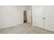 Carpeted bedroom with view of a closet and hall bathroom at 309 Plank Bridge Way, Morrisville, NC 27560