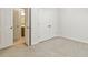 Carpeted bedroom features a bathroom and a closet at 309 Plank Bridge Way, Morrisville, NC 27560