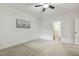 Bright bedroom has white walls and carpet and doorway to a walk in closet at 309 Plank Bridge Way, Morrisville, NC 27560