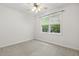 A bedroom features a window with blinds and soft carpeting at 309 Plank Bridge Way, Morrisville, NC 27560