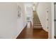 Foyer featuring hardwood flooring, a staircase, and an open view to the home's interior at 309 Plank Bridge Way, Morrisville, NC 27560