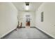 Attached garage leading to the kitchen with painted floors at 309 Plank Bridge Way, Morrisville, NC 27560