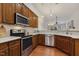 Charming kitchen boasting stainless steel appliances and ample counter space for cooking at 309 Plank Bridge Way, Morrisville, NC 27560