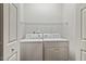 Bright laundry room with side-by-side washer and dryer, and useful wire shelving at 309 Plank Bridge Way, Morrisville, NC 27560