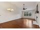 Bright living room featuring a vaulted ceiling, hardwood floors, and a fireplace with a white mantel at 309 Plank Bridge Way, Morrisville, NC 27560
