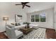 Comfortable living room with modern decor, vaulted ceilings, and a large window overlooking the landscape at 309 Plank Bridge Way, Morrisville, NC 27560