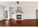 Spacious living room showcasing a fireplace, hardwood flooring, and a glass door to the porch at 309 Plank Bridge Way, Morrisville, NC 27560